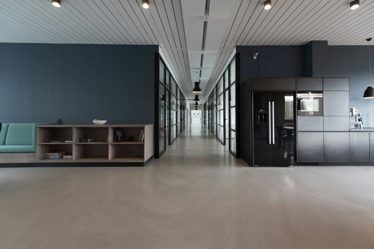 Modern workspace where AI agents serve human operators